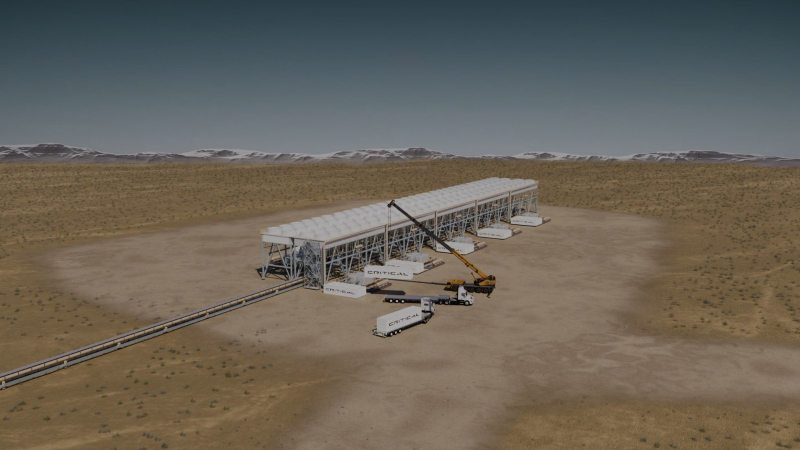 Rendering of a Critical Energy power plant under construction in the desert, with a crane placing container modules beneath a long air-cooled condenser structure